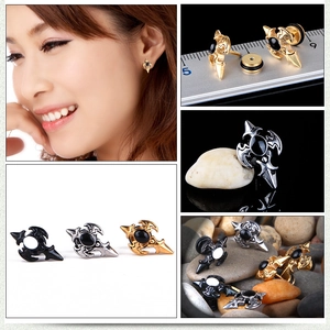 Detailed close-up of gothic cross earrings with black stones and screw backs in various colors