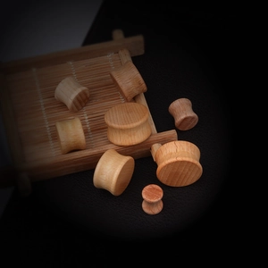 Handcrafted solid purple heart wood ear plugs and tunnels with natural grain texture