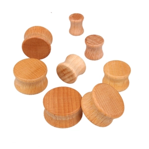 Natural wood flesh tunnels and saddle plugs in various sizes for ear stretching