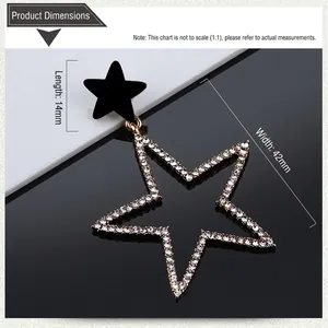 Detail showing oversized star drop earrings with dimensions of 14mm and 42mm