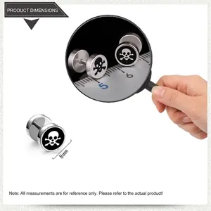 Close-up of 8mm titanium steel barbell earring featuring white skull and crossbones design