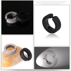 Macro detail of black and silver matte surgical steel non-pierced clip-on hoop earrings