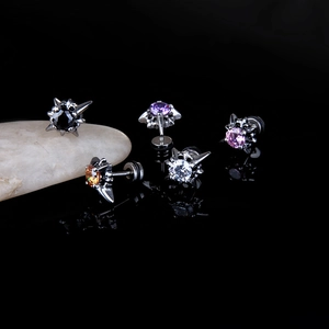 Punk style stainless steel stud earrings with colorful cubic zirconia on black mirror surface