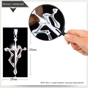 Macro detail of Sagittarius stainless steel cross pendant with dimensions 55mm by 29mm