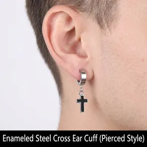 Close-up of cross charm earring with black drip oil finish on male model ear