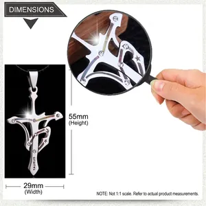 Detailed macro view of 55mm Taurus cross pendant with stainless steel crystals