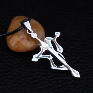 Polished Sagittarius archer pendant necklace with silver finish on black leather backdrop