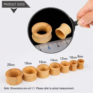 Detailed view of bamboo wood ear gauges showing natural grain and size scale from 8mm to 20mm