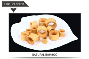 Macro detail of natural bamboo ear tunnels showing organic fiber texture and polished finish
