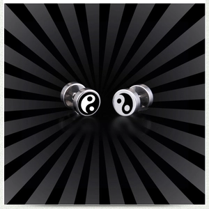 Detailed view of stainless steel barbell earrings featuring black and white Yin Yang designs