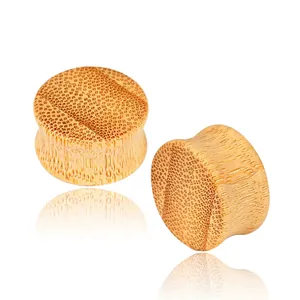 Natural bamboo double flared ear plugs with authentic wood grain texture on white background