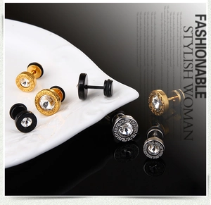Detailed macro view of vintage Greek pattern earrings with sparkling center zircon