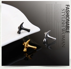 Detailed view of hammer-shaped stainless steel stud earrings in black, gold, and silver
