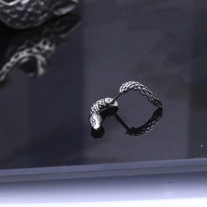 Punk style silver snake ear cuff with vintage finish and wrap-around coiled design