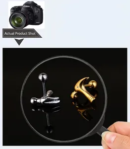 Detailed view of hammer-shaped titanium steel stud earrings in silver and gold finishes