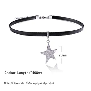 Close-up of sparkling star pendant on black cord choker with 20mm size detail