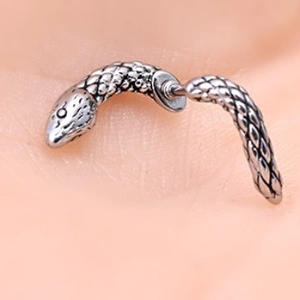 Silver snake ear cuff with textured scales showing unique wrap-around punk design