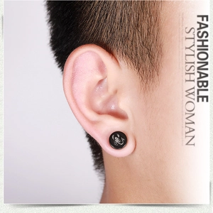 Black magnetic stainless steel stud earring featuring a white scorpion graphic design
