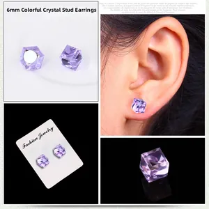 Macro shot of 6mm purple crystal magnetic earrings with faceted stones and card
