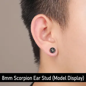 8mm magnetic black scorpion stud earring shown on a model's ear in close-up detail