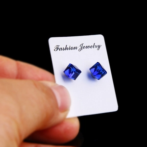 Navy blue cube-cut magnetic crystal stud earrings with polished multi-faceted finish