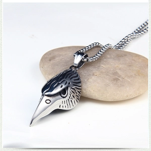 Close-up of gothic eagle skull pendant with vintage silver finish and bead chain