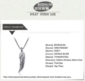 Detail view of silver wing pendant showing 15x62mm dimensions and 600mm chain length