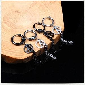 Detail of stainless steel drop earrings with peace sign and long chain tassels in two colors