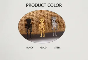 Three punk skull earrings with crown design in black, gold, and steel finishes on burlap
