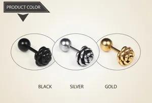 Detailed view of rose flower stud earrings in black, steel, and gold finish