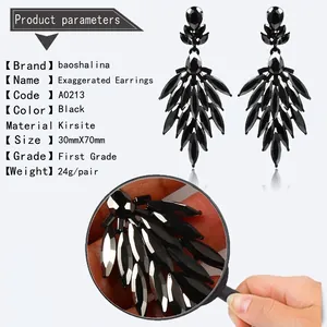 Detailed view of large black teardrop earrings in zinc alloy with rhinestone crystal layout