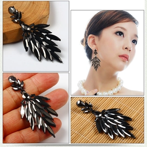 Luxury black teardrop chandelier earrings featuring leaf-shaped crystal gems