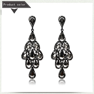 Detail shot of vintage black crystal chandelier earrings with luxury water drop stones