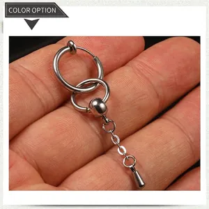 Macro shot of silver stainless steel earring with hanging chain and teardrop charm