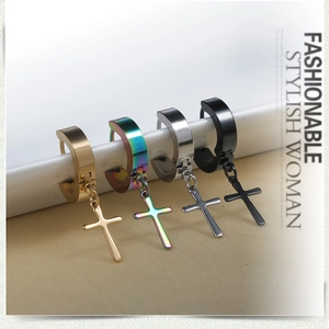 Macro shot of cross pendant hoop earrings in gold, rainbow, silver and black finishes