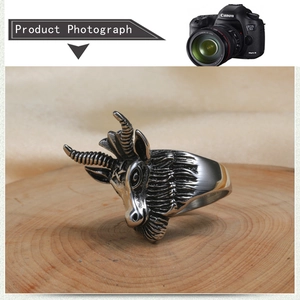 Macro view of detailed ram head totem engraving on a vintage stainless steel ring