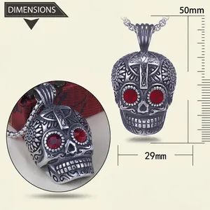 Detailed view of punk skull pendant with red stone eyes and cross carving, size 50mm x 29mm