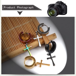 Cross pendant hoop earrings set in gold, silver, black, and rainbow stainless steel