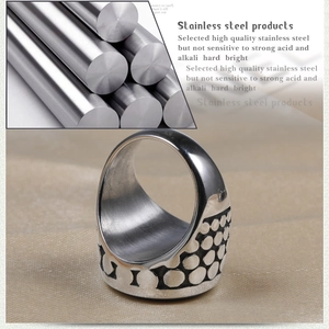Men's vintage stainless steel ring with black etched patterns and industrial design