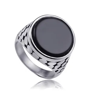 Men's vintage stainless steel ring with black round stone and textured silver band