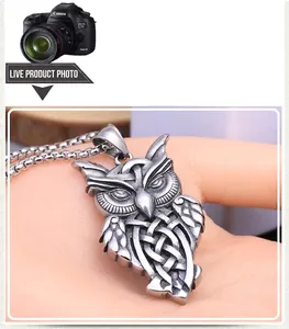 Macro shot of owl pendant with Celtic knot pattern and vintage silver finish