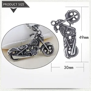 Detailed view of vintage stainless steel motorcycle pendant showing dimensions 49mm by 30mm