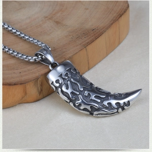 Men's retro wolf tooth pendant necklace in 316L stainless steel on wooden stand