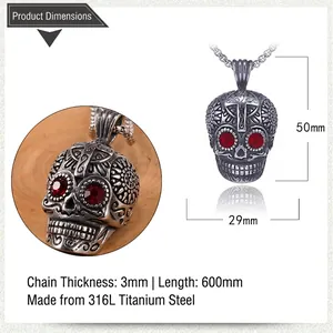 Detail of 316L stainless steel ghost skull pendant with red stones and cross engraving