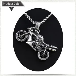 Detail shot of vintage silver motorcycle pendant with stainless steel box chain necklace
