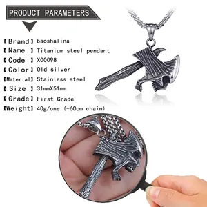 Detailed view of vintage stainless steel axe pendant with skull carving and wood grain texture