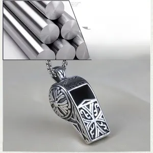 Detailed view of stainless steel whistle pendant featuring vintage floral engravings