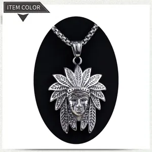 Detail of vintage silver Indian chief head pendant with intricate feather headdress and chain