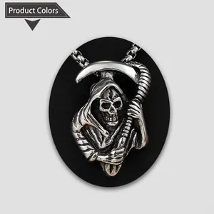 Close-up of gothic grim reaper scythe and skull pendant with vintage silver finish