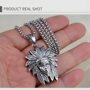 Detailed close-up of a vintage steel necklace featuring a Native American chief pendant